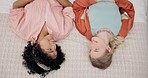 Couple of friends, talking and home bed for conversation, bonding and relax. Above, gay women and interracial girls in communication for lesbian relationship, connection or care for lgbtq partner