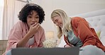 Laptop, comedy movie or friends on a bed with popcorn for comic, standup joke or show at home. Funny talk show, smile or people laugh watching film in bedroom with snack to relax on streaming service