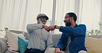 Family, fist bump and sofa with greeting, motivation and handshake with man and grandpa. Living room, support and love in a lounge together with a happy smile, solidarity and black people on couch