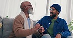 Conversation, bonding and man with his senior father on a sofa in living room for communication. Happy, smile and young African male person talking and laughing with his elderly dad in lounge at home