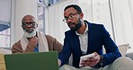 Financial advisor, senior man and calculator on laptop for asset management, retirement planning or financial advice. African men or clients on sofa with home budget, taxes and investment on computer