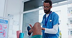 Physiotherapy, stretching legs or doctor with patient in hospital for body healing recovery. Physical therapy, knee rehabilitation or injured black man consulting medical physician to help injury