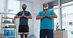 Black people, yoga and personal trainer in meditation, zen workout or exercise together at clinic. African yogi men in relax, healthcare or fitness for spiritual wellness, mindfulness or awareness