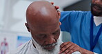 Physiotherapy, medical worker and mature man with neck pain for massage, rehabilitation and healing at health clinic. Physiotherapist, people and healthcare professional with patient for stretching 
