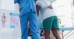 Senior care, support and physiotherapist with black man, walking and healthcare from back. Physio rehabilitation coach, nurse or caregiver with elderly patient in mobility training clinic in Africa.