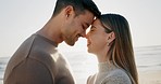 Eskimo kiss, couple and travel, happiness at the beach and love with bonding, romantic date outdoor and forehead touch. Adventure, man and woman in healthy relationship, sunshine and ocean with peace