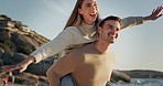 Airplane, love and couple at the beach for travel, piggyback and bond with freedom, fun and happy in nature. Flying, carrying and man with woman at sea for holiday celebration at the ocean in Cancun