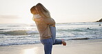 Couple hug, beach and freedom with love, adventure and together on romantic date at sunset. Travel, woman running into man arms and energy, embrace and trust with support and care outdoor in nature