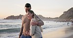 Couple, hug and walk on beach with view, peace and travel, calm and trust with love and care outdoor. People on romantic date, sunshine and adventure with commitment, support and healthy relationship