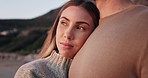 Beach, sunset and couple hug for love, support and commitment in nature relax on weekend. Healthy relationship, dating and calm woman and man embrace by ocean for holiday, vacation and honeymoon