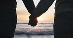 Silhouette, couple and holding hands, sunset at beach with love and bonding, commitment and romantic date outdoor. Man, woman and healthy relationship with adventure, support and trust with freedom