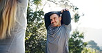 Park fitness, stretching and happy man, couple or team consulting personal trainer, coach and talk about challenge. Forest workout, training partner and nature athlete, runner or people start warm up