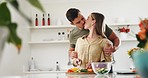 Ingredients, kiss and couple in the kitchen cooking together for bonding with gourmet recipe. Happy, smile and young man and woman cutting vegetables for preparing health dinner or lunch meal at home