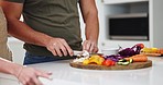 Hands, knife and vegetables in kitchen, couple and home for cooking, preparation or ready for nutrition. Man, diet and mushroom with vegan meal, food or healthy product for dinner, brunch or wellness