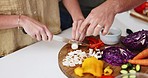 Hands, knife and vegetables for couple in home kitchen for cooking, teaching or ready for nutrition. Man, diet and mushroom with advice for vegan meal, food and health with dinner, brunch or wellness