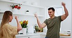 Fun, kitchen and happy couple dance to music, disco song or radio audio for crazy date, goofy partner or movement energy. Connect, dancer freedom and home woman, man or funny marriage people bonding