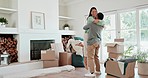 Hug, couple and celebrate new house with a smile, love or excited about moving in together. Security, support and interracial man and woman with mortgage, rent or loan for real estate with boxes