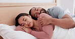 Happy couple, bed and sleeping in morning, relax or holiday weekend and break together on pillow at home. Man and woman hug and lying in bedroom, comfort or love in nap, rest or asleep at house