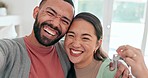 Couple, selfie and keys to new house with a smile, love and excited about moving in together. Social media, profile picture and interracial man and woman with mortgage, rent or loan for real estate