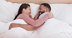 Happy couple, bed and laughing in morning joke, relax or together on funny holiday, weekend or break at home. Man and woman smile lying in bedroom happiness, wake up or humor in bonding at house