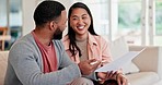 Happy couple, planning and documents for home budget, financial paperwork and taxes or asset management on sofa. Interracial man and woman bills, loan payment and discussion of mortgage or investment