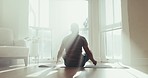 Zen, yoga and meditation with man in living room for spiritual, mindfulness and fitness. Mental health, relax and wellness with person and workout at home gym for peace, stretching and balance