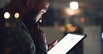Online, thinking and business man on tablet in dark office, working on research project, website and planning. Corporate, networking and worker on digital tech for solution, internet or brainstorming