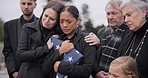 Sad, family and funeral with comfort, woman and support with compassion, empathy and depression. People, wife of loved one and friends with love, USA flag and sympathy with grief, goodbye or remember