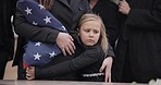 USA veteran funeral, girl and sad family with hug, care and flag for mourning, depression and comfort with mom. Kid, people and service with coffin, burial or memorial with war hero in Philadelphia
