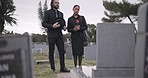 Couple, sad and mourning at tombstone of graveyard, funeral and pay respect together outdoor. Death, grief and man and woman at cemetery by casket, empathy and interracial support to console at tomb