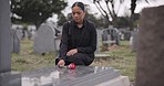 Sad woman, graveyard and rose on tombstone in mourning, loss or grief at funeral or cemetery. Female person with flower in depression, death or goodbye at memorial or burial service for loved one