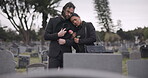 Couple, sad and mourning at tomb of graveyard, funeral and pay respect together outdoor. Death, grief and man and woman at cemetery by casket, empathy and interracial support to console at tombstone