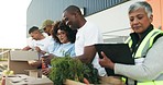 Happy people, volunteer and box in NGO, charity or community service in teamwork together. Group of volunteering workers or team packing parcel, package or boxes in donations, social or contribution