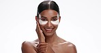 Face, eye patches and woman with skincare, dermatology and treatment isolated on a white studio background. Portrait, person or model with cosmetic pads, aesthetic and beauty with grooming routine