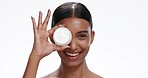 Face of Indian woman with jar of cream for skincare, wellness and facial cosmetics on white background. Dermatology, beauty and portrait of person with moisturizer, lotion and spa products in studio