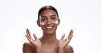 Face of Indian woman with cream for beauty, wellness and facial care in white background studio. Dermatology, skincare and portrait of isolated person for anti aging moisturizer, lotion or cosmetics 