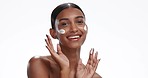 Face of happy Indian woman with cream for beauty, wellness and facial cosmetic on white background. Spa, skincare and portrait of isolated person in moisturizer, lotion and anti aging creme in studio