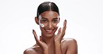 Face of happy Indian woman with cream for skincare, wellness and facial cosmetics on white background studio. Spa, beauty and portrait of isolated person with moisturizer, lotion and anti aging creme