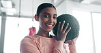 Woman, face and medicine ball, fitness in gym and smile for health and wellness with equipment and sports. Athlete, active and exercise gear, workout and training with portrait and self care