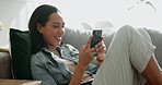 Woman, phone texting and home with social media post, networking and online on a sofa. Mobile app, happy message and typing on a living room couch with digital entertainment and tech in a house