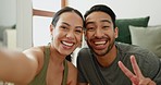 Couple, happy selfie and peace at home with a smile, hand or wink for healthy relationship. Portrait of a man and woman together in living room for profile picture, memory and social media with love