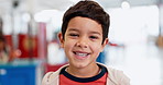 Face, research and a student boy at a science fair for learning, growth or child development. Portrait, smile and future with a happy young male kid at a school closeup for education or experiment