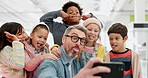 Teacher man, happy school kids and funny selfie with sign, classroom or diversity for group memory. Education, learning and mentor with comic photography, friends or development on social network app