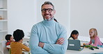 Face, man and teacher with arms crossed in kindergarten school for education. Portrait, confident educator and mature person happy with student kids for learning, knowledge and study in classroom