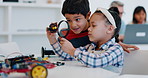 Children, magnifying glass and robotics teamwork for learning in kindergarten. Kids, lens and robot science for search, inspection and education for investigation in engineering of students at school