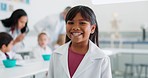 Science, girl and classroom with face and learning at school and education for development. Lab, research and kids portrait of a young student with a smile ready for knowledge and chemistry study