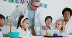 Man, education and children in a class for science, innovation and conversation about physics. Research, school and a teacher with kids or students learning about chemistry or studying liquid