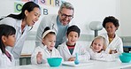 Project, chemistry and teachers with kids in a class for an experiment, study or research. Education, science and team of scientists teaching children students a chemical reaction in a school lab.