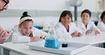 Science, experiment and reaction with student kids in a classroom for education, learning or development. School, study and laboratory with a group of children in class for chemical test or research