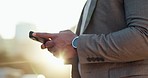 Businessman, phone and hands typing in city for communication, social media or outdoor networking. Closeup of man or employee in online chatting or texting on mobile smartphone app in an urban town